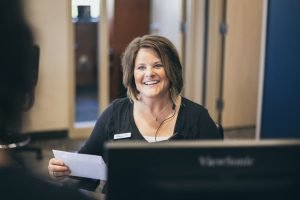 The Dexter Family Dentistry receptionist greeting patients