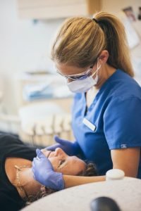 Dentist discussing cosmetic dentistry with patient