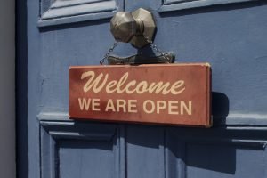 Welcome sign hanging on door